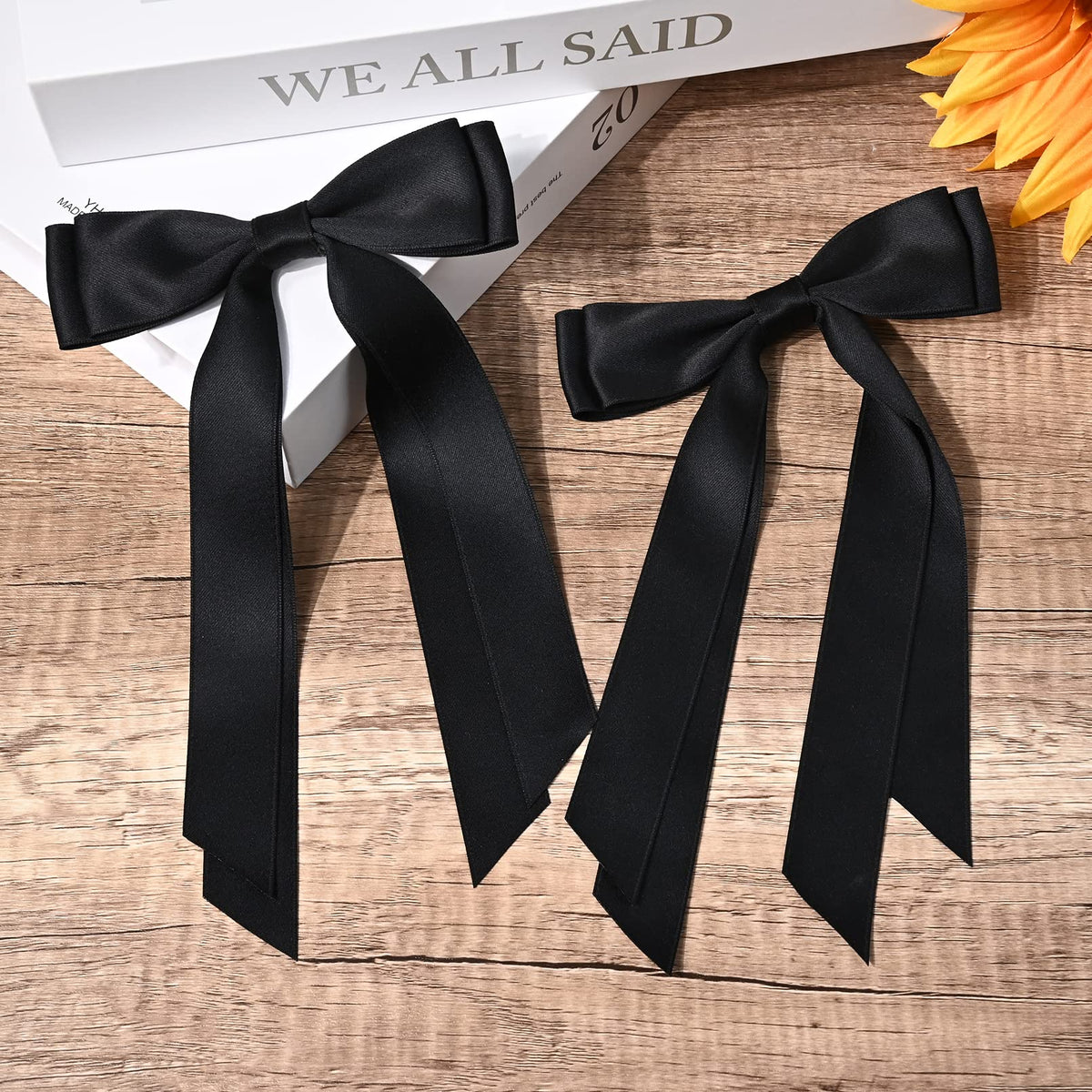 Aileam Bows en satin noir sur des vêtements