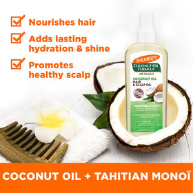 Application de l'huile de coco sur des cheveux humides