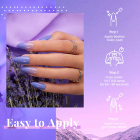 Application du vernis gel violet pâle sur des ongles