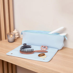 BAREFOOT CARIBOU trousse de voyage dans un bagage