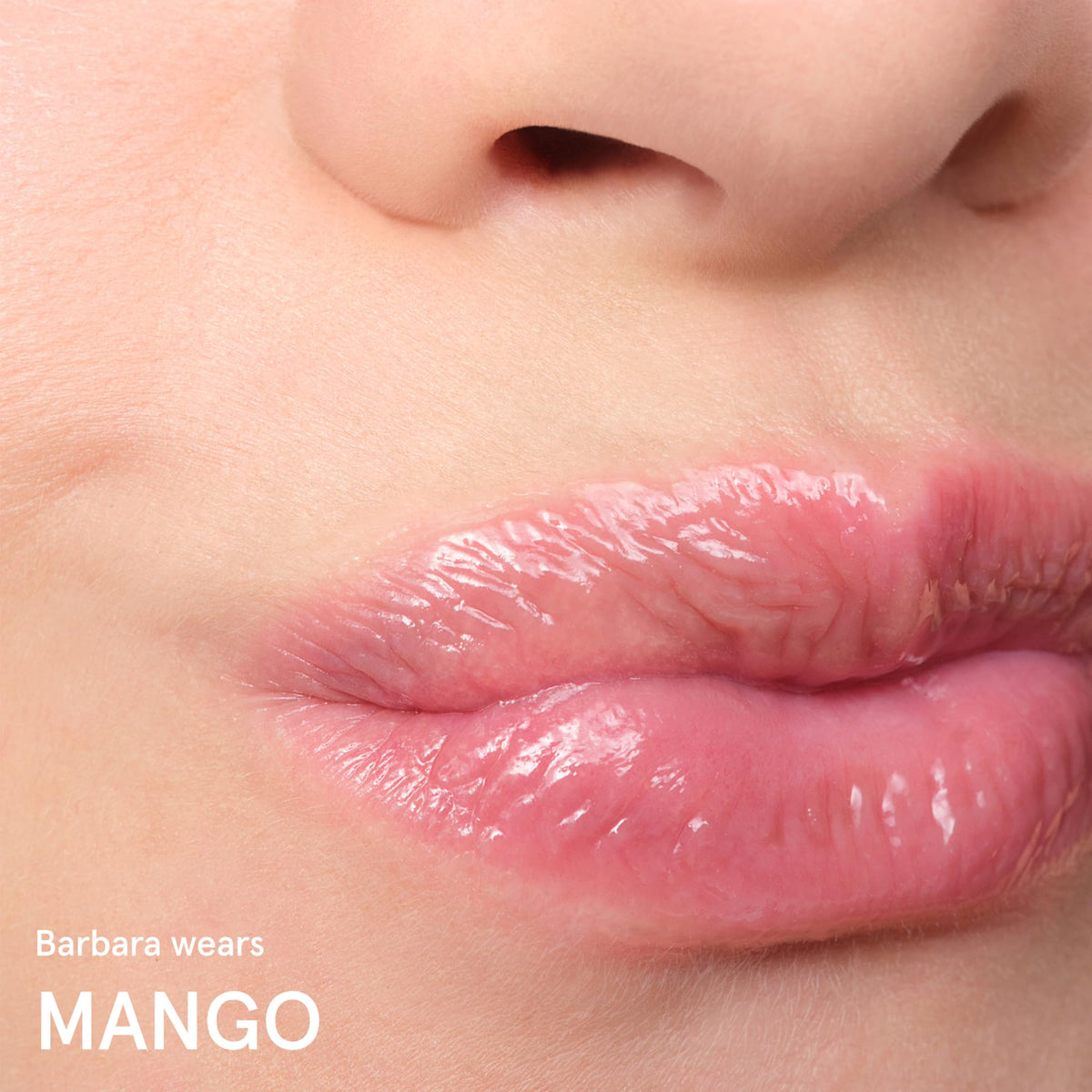 Baume Glossier Balm Dotcom teinté mangue sur peau
