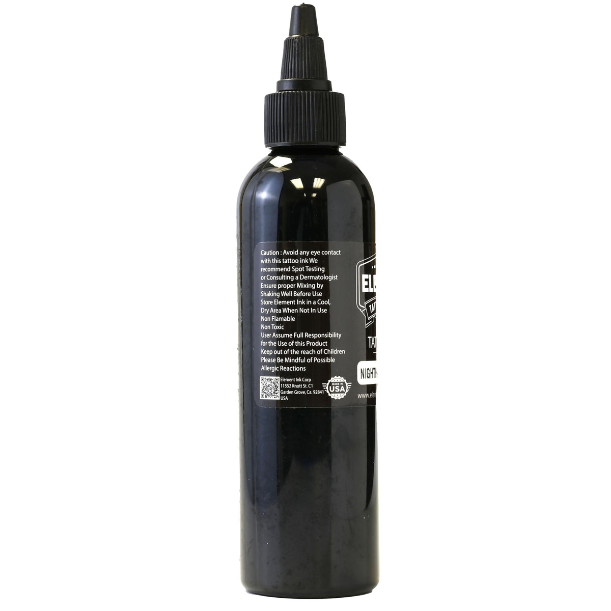 Bouteille d'encre Nighthawk 4oz sur une table de tatouage
