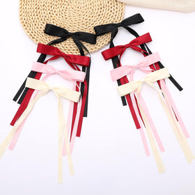 Bows à Cheveux WORTL présentés sur un fond neutre