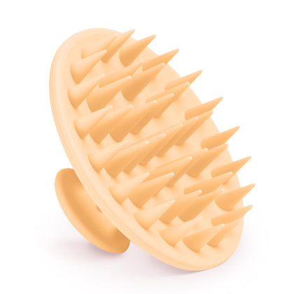 Brosse de massage du cuir chevelu Meartchy en silicone rose saumon vue de face