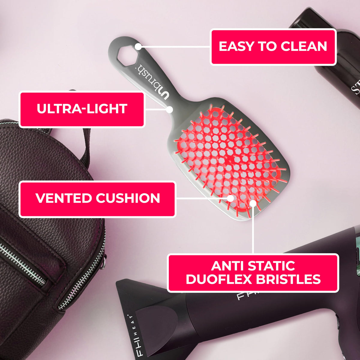 Brosse FHI Heat UNbrush à côté d'autres outils de coiffure