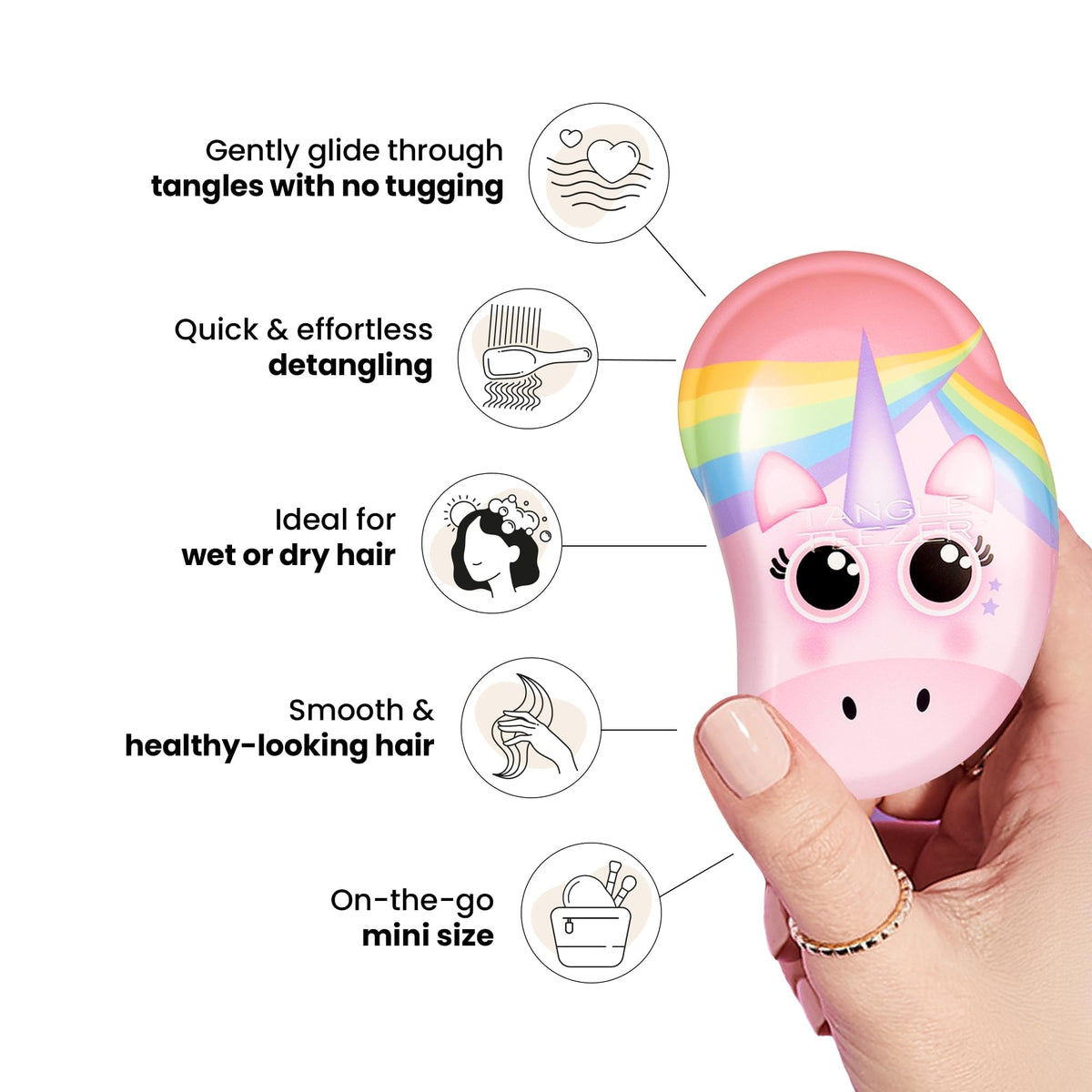 Brosse TANGLE TEEZER Mini dans la main d'un enfant