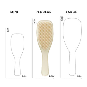 Brosse TANGLE TEEZER sur une surface en bois, vue de dessus