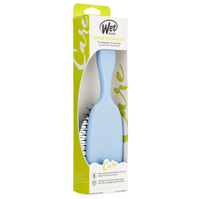 Brosse Wet Brush Shine support posée sur une coiffeuse