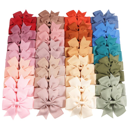 CÉLLOT barrettes en grosgrain avec nœuds en pinwheel colorés