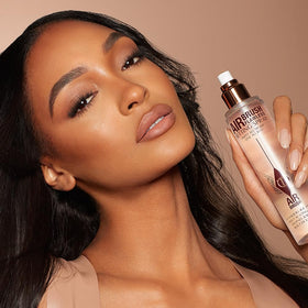 Charlotte Tilbury Airbrush Flawless Spray avec d'autres produits de beauté