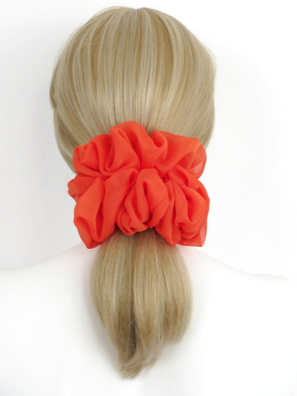 Chouchou orange avec élastique résistant et texture douce