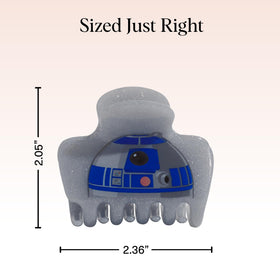 Clip à cheveux Kitsch R2-D2 sur un bureau