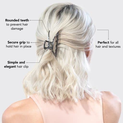 Clip Kitsch en hématite sur une table avec des accessoires de coiffure