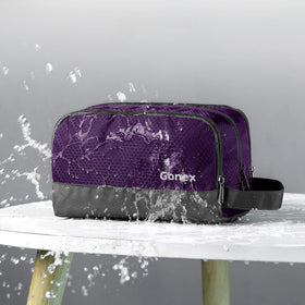 Compartiment principal de la trousse Gonex avec bouteilles de shampoing