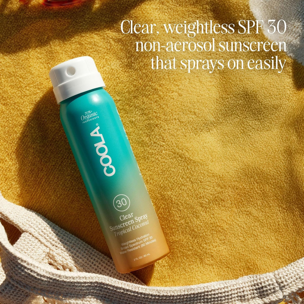 COOLA Crème Solaire Bio sur une serviette de plage
