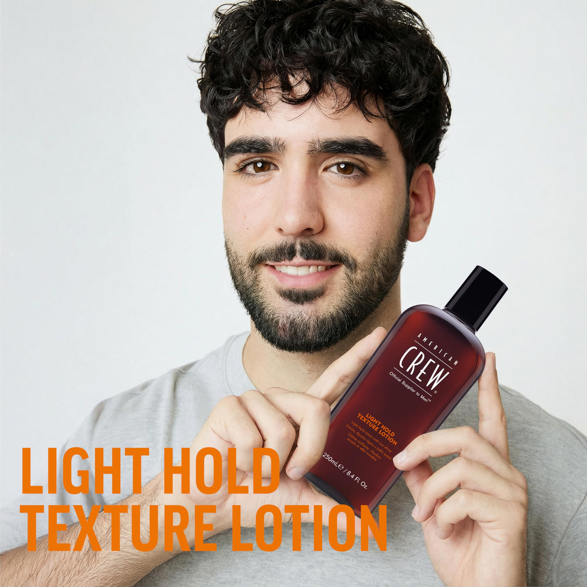 Détails de la Lotion Texturisante AMERICAN CREW sur une table