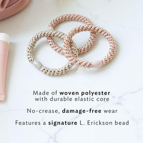 Élastique à cheveux vert menthe L. Erickson sur fond blanc