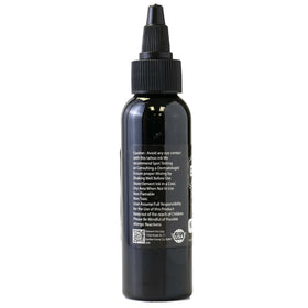 Encre noire Nighthawk 2oz avec gouttes sur une surface