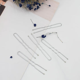 Épingles à cheveux YINGFENG sur un fond neutre