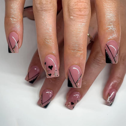 Faux ongles press-on courtes avec paillettes dorées, vue de face