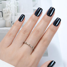 Faux ongles pressés UNA GELLA 32 pièces en noir chrome, vue de face