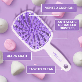 FHI Heat UNbrush Plus sur fond blanc, focus sur les brins