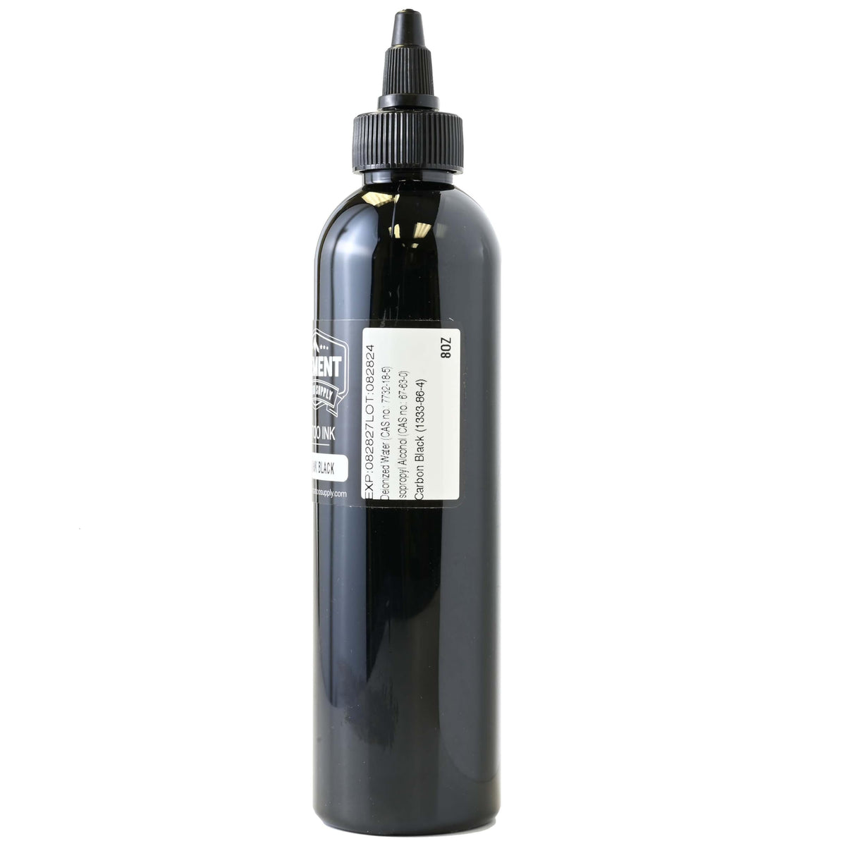 Flacon d'encre noire Nighthawk 8oz sur un bureau de tatouage