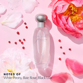 Flacon d'Estée Lauder Pleasures sur une surface élégante