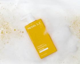 Flacon de gel douche Medix 5.5 avec agrumes en arrière-plan