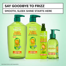 Garnier Fructis 10-en-1 spray sur coiffeuse avec accessoires de beauté