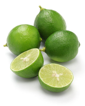 Huile essentielle de citron vert US Organic en utilisation sur un bureau