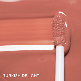 LAURA GELLER Color Luster Lip Gloss Turkish Delight texture sur main