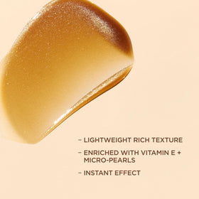 Lotion auto-bronzante L'Oreal Paris Sublime Bronze sur une surface en bois