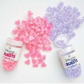Lotion Bursts Jergens sur un fond pastel