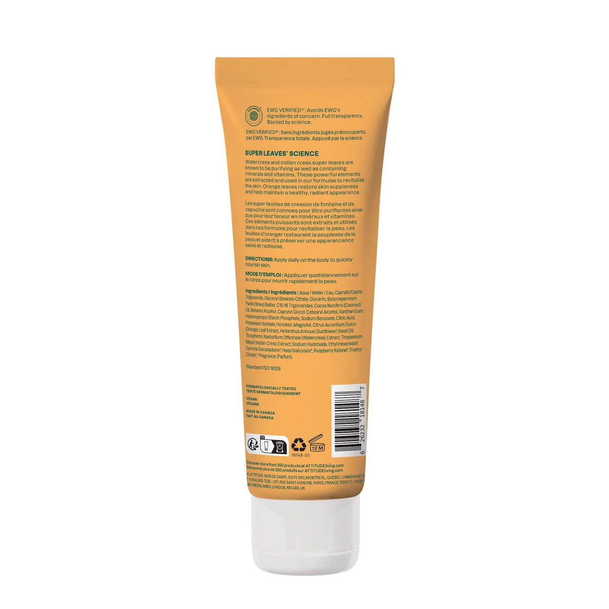 Lotion corps ATTITUDE sur une table avec des fleurs d'oranger