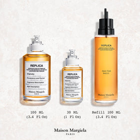 Maison Margiela Jazz Club Eau de Toilette 100ml près d'un verre de whisky