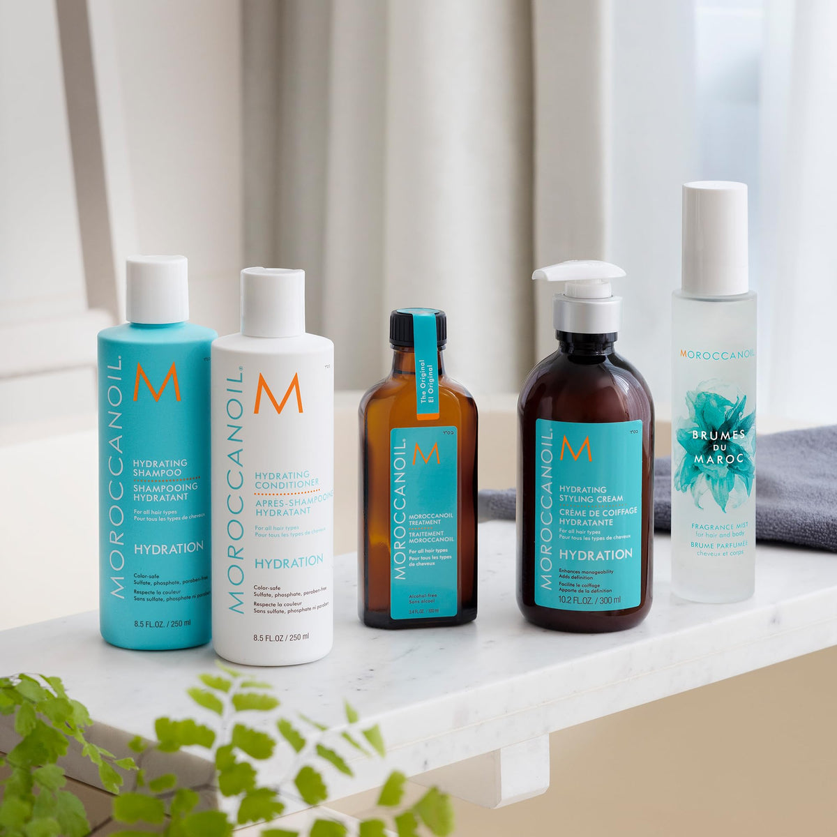 Moroccanoil Crème Coiffante Hydratante 340g application sur cheveux