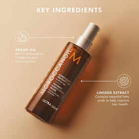 Moroccanoil Huile Traitement Cheveux 25 ml en application sur cheveux