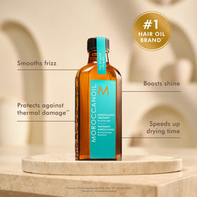 Moroccanoil Traitement Huile Cheveux 25 ml avec goutte d'huile sur main