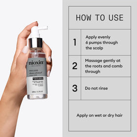 Nioxin Diamax Advanced Sérum Épaississant en situation sur une coiffeuse