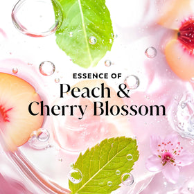 Olay Gel Douche Fresh Radiance 1L près d'une fleur de cerisier