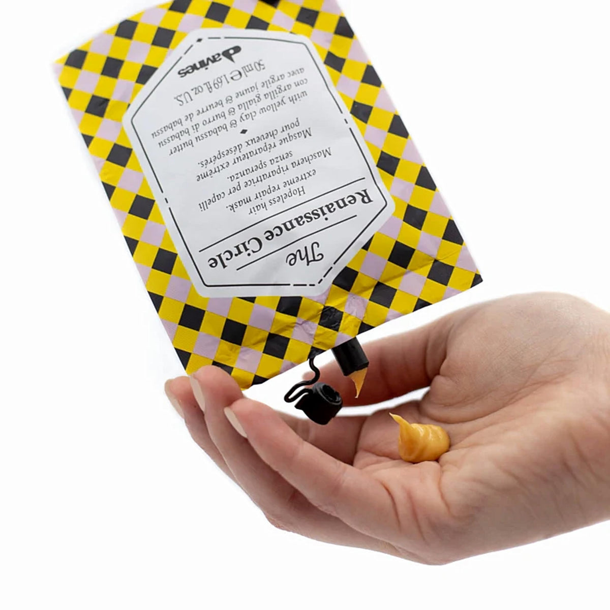 Packaging du masque réparateur Davines sur une surface en bois