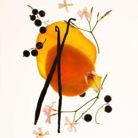 PHLUR Mango Mood Brume sur une surface en bois avec des fruits