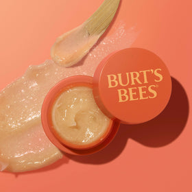 Pot de masque de nuit Burt's Bees à côté de fruits frais