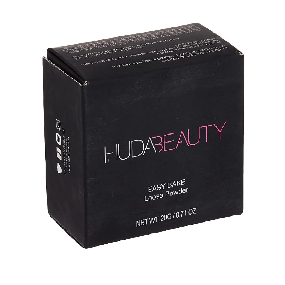 Poudre H.U.D.A BEAUTY Easy Bake mise en scène avec d'autres produits de maquillage
