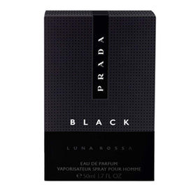 Prada Luna Rossa Black Eau de Parfum sur une table avec un fond marin