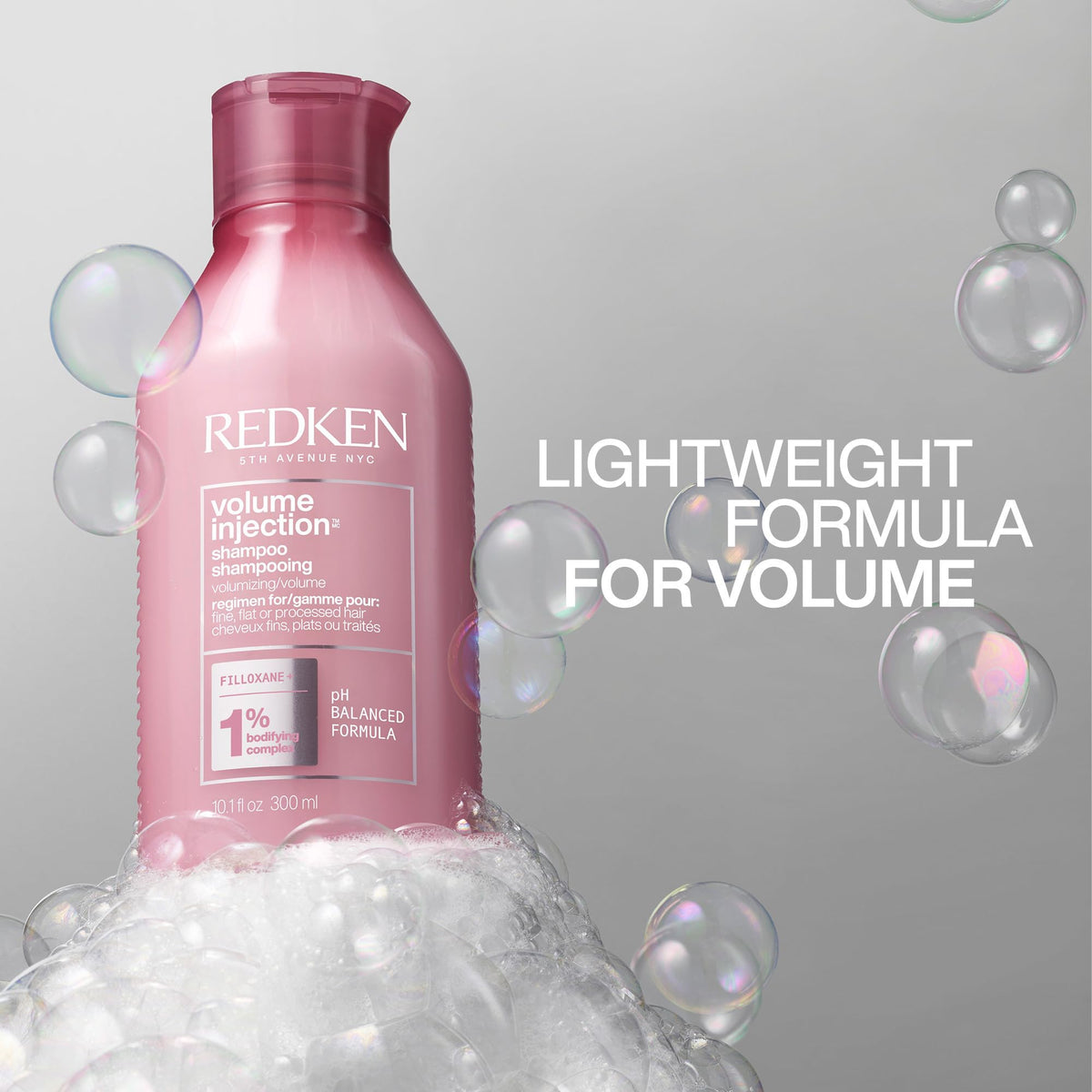 Redken Shampoo Volume Injection 340g sur un lavabo
