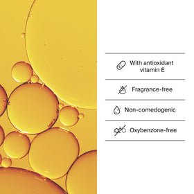 Sérum solaire Neutrogena sur une main avec fond neutre