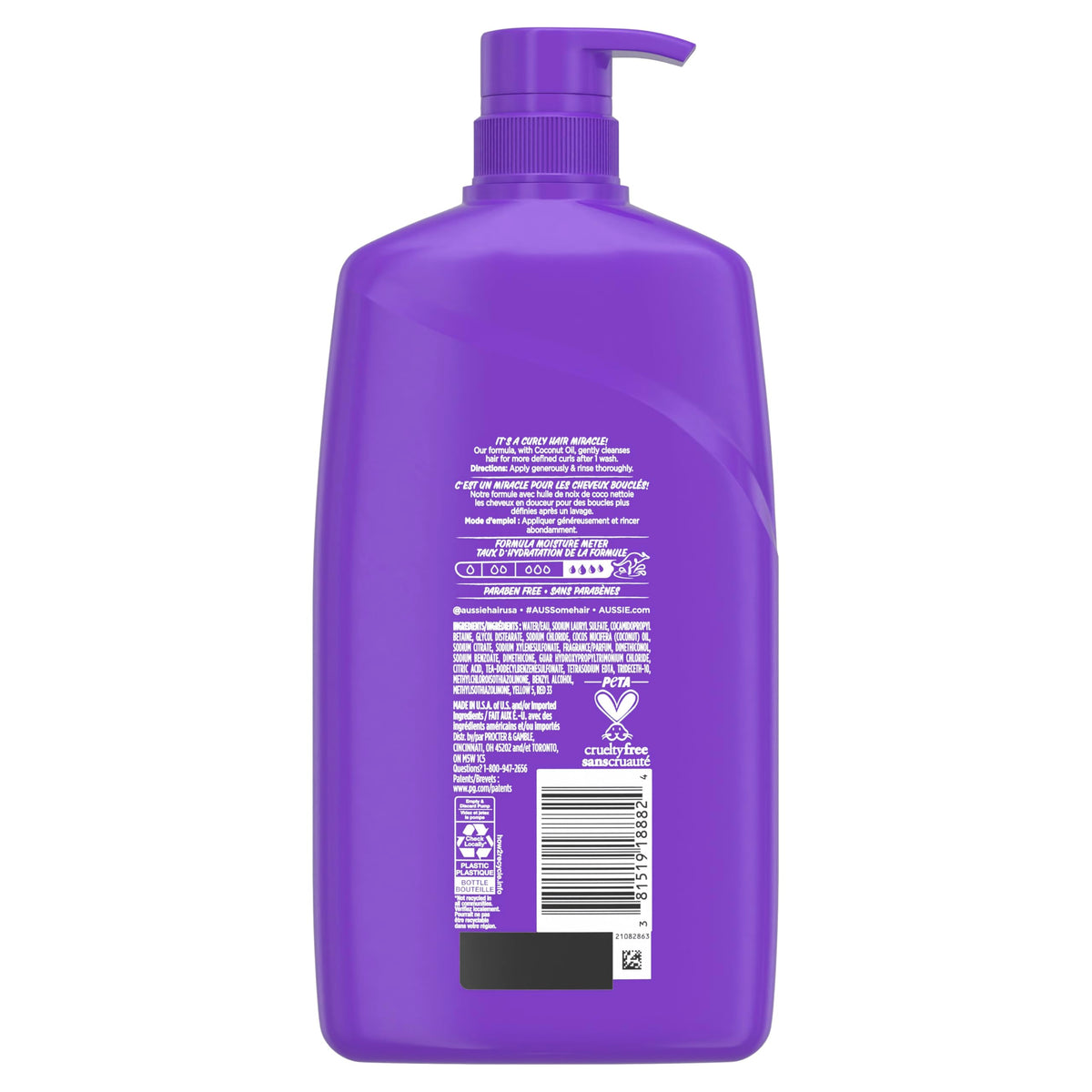 Shampooing Aussie Miracle Curls avec fruits et fleurs en arrière-plan