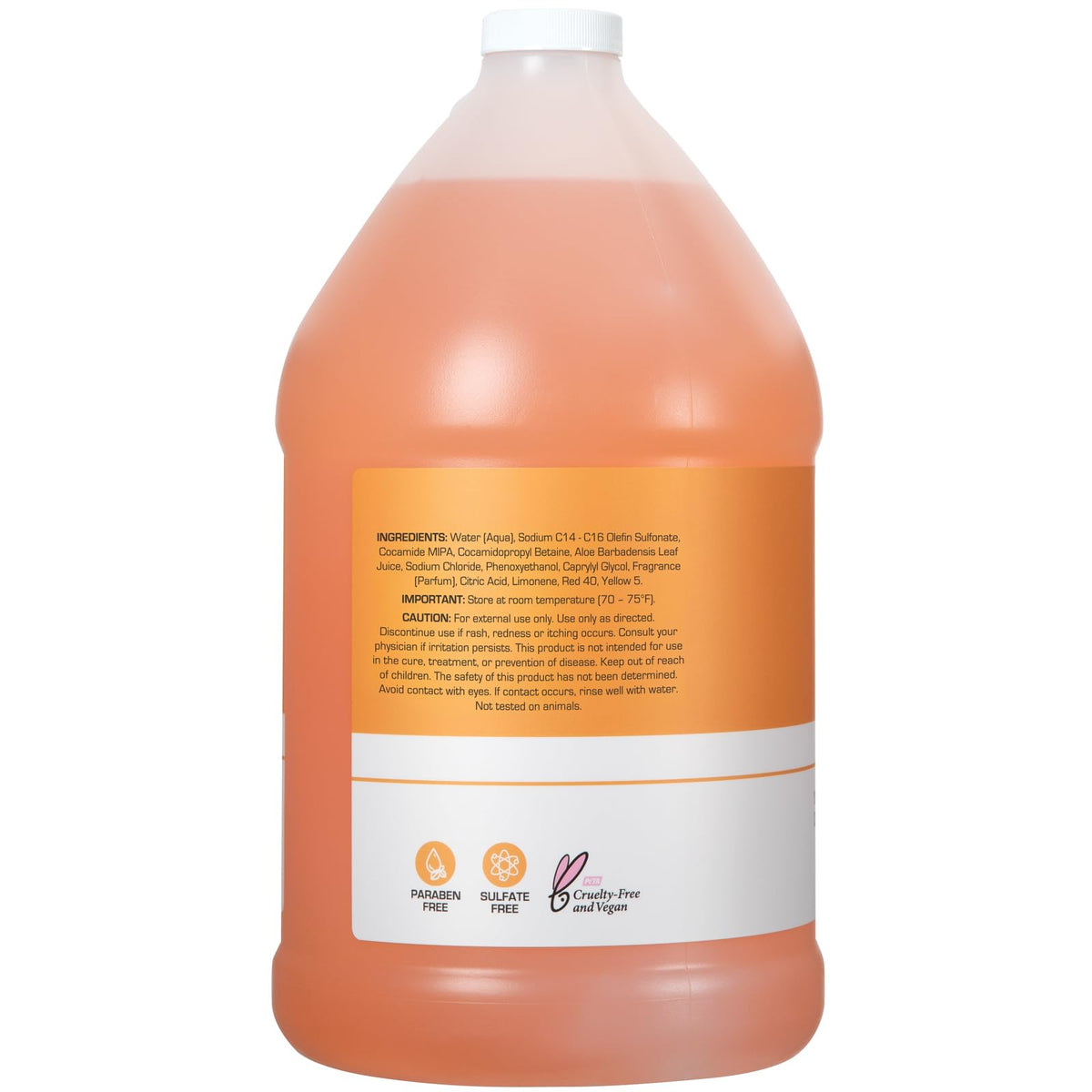 Shampooing Ginger Lily Farms avec agrumes en arrière-plan